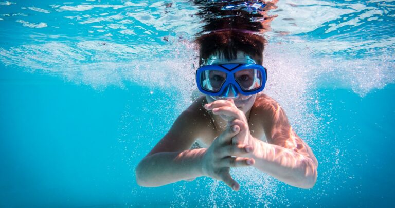 kid swimming in pool