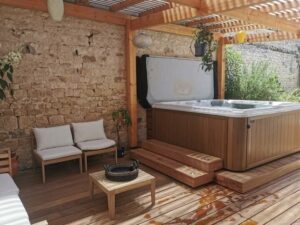 An Open Hot Tub Underneath A Raised Deck As A Hot Tub Enclosure